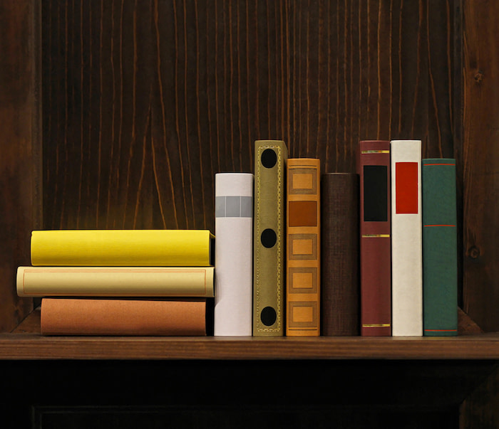 Dark wood book shelf with old books