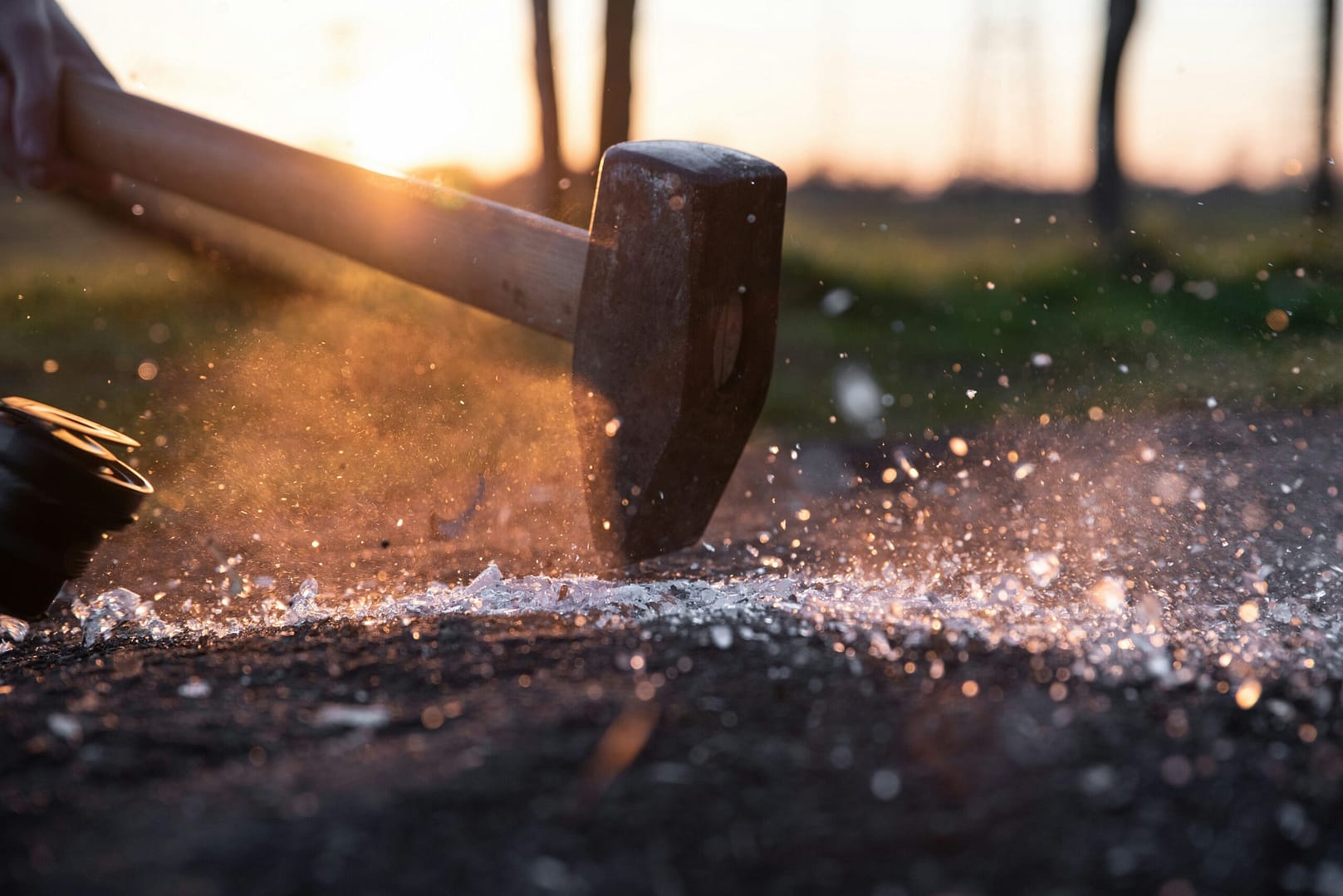 A sledgehammer breaks glass