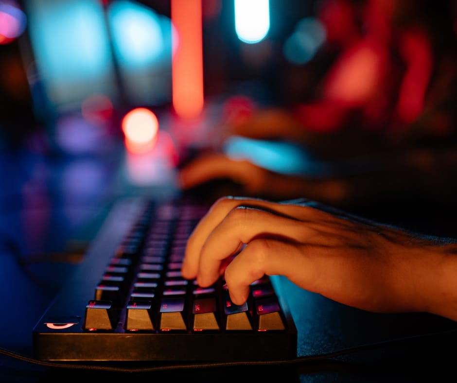 Person typing on a keyboard