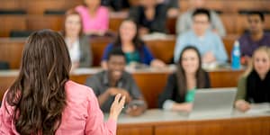 woman lectures in a college classroom