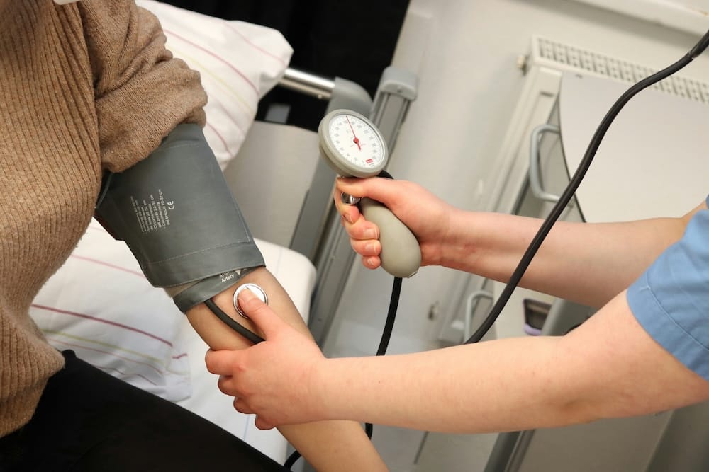 Nurse takes a patient's blood pressure