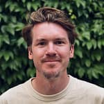 Carter Moulton's headshot - man with sandy brown hair and a warm smile