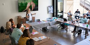 bonni presents in front of a group of new faculty with a slide that shows a picture of bare feet