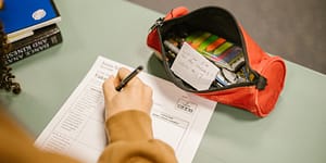 student uses notes to cheat on an exam