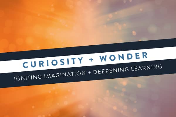 Curiosity and Wonder with orange and blue abstract sparks/explosion in background