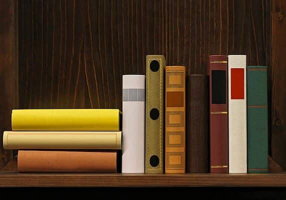 Dark wood book shelf with old books