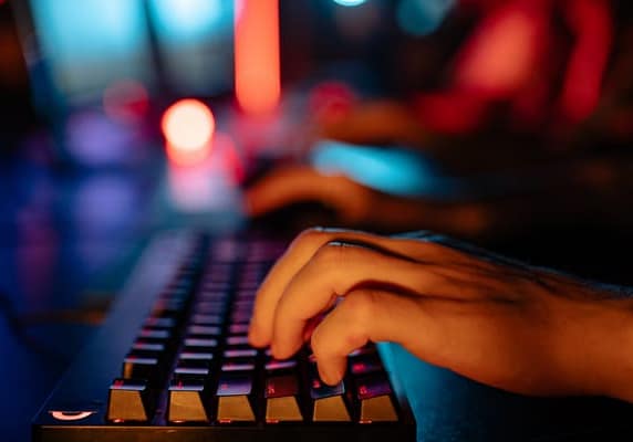 Person typing on a keyboard